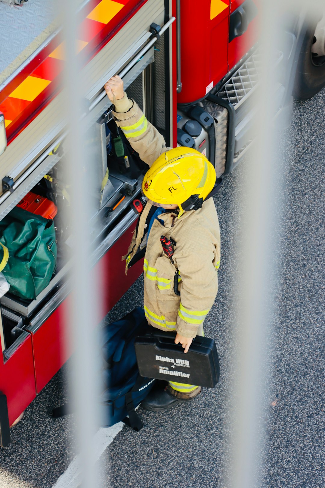 firefighter-in-uniform-with-helmet-and-case-itshs11lv4q